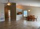 Open concept dining room with a modern chandelier and convenient access to the kitchen and adjacent rooms at 1210 Etchfield Cir, Brandon, FL 33511