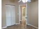 Hallway featuring tile flooring, access to closet and bedroom at 1210 Etchfield Cir, Brandon, FL 33511