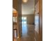 Hallway view of living room, kitchen, and access to the outdoor pool at 1210 Etchfield Cir, Brandon, FL 33511