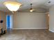 Spacious open-concept living room with vaulted ceilings, ceiling fans, and tile flooring at 1210 Etchfield Cir, Brandon, FL 33511