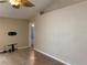 Neutral toned living room with tile flooring and a ceiling fan at 1210 Etchfield Cir, Brandon, FL 33511