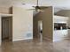 Open living room showcases neutral walls and tile flooring, leading to the kitchen at 1210 Etchfield Cir, Brandon, FL 33511