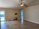 Living room with sliding doors leading to a screened in pool at 1210 Etchfield Cir, Brandon, FL 33511