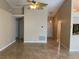 Open-concept living room featuring tile flooring, neutral paint, and ceiling fan at 1210 Etchfield Cir, Brandon, FL 33511