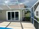 Screened-in lanai with pool access via sliding glass doors; perfect for outdoor relaxation at 1210 Etchfield Cir, Brandon, FL 33511