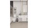 Modern bathroom featuring a toilet, decorative wall art, and stylish vanity with marble countertop at 25197 Delgado Dr, Punta Gorda, FL 33955