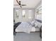 Bright bedroom with a platform bed, decorative pillows, and natural light from large windows at 25197 Delgado Dr, Punta Gorda, FL 33955