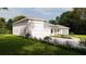 Elegant single-story home boasting a well-manicured lawn, a two-car garage, and flower beds at 25197 Delgado Dr, Punta Gorda, FL 33955