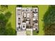 Detailed floor plan showcases a large garage, open living spaces, bedrooms, and an outdoor patio at 25197 Delgado Dr, Punta Gorda, FL 33955