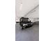 Spacious garage featuring a van, motorcycle, and car providing ample parking and storage at 25197 Delgado Dr, Punta Gorda, FL 33955