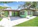Backyard with stone patio and grassy area at 1453 Thames Ln, Clearwater, FL 33755