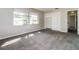This bedroom has neutral paint and carpet and a double-door closet with built-in shelving at 1453 Thames Ln, Clearwater, FL 33755