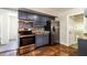 Modern kitchen with stainless steel appliances, granite countertops, and mosaic backsplash at 1453 Thames Ln, Clearwater, FL 33755