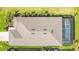Overhead view of home highlighting the roof, screened pool, and landscaping at 10735 Spring Tide Way, Parrish, FL 34219