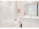 Bathroom featuring a bathtub, toilet, and vanity with ample counter space at 10735 Spring Tide Way, Parrish, FL 34219