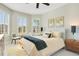 Bright bedroom with natural light, neutral tones, and minimalist design elements at 10735 Spring Tide Way, Parrish, FL 34219