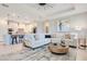 Bright and airy living room with comfortable seating, modern decor, and an open-concept layout at 10735 Spring Tide Way, Parrish, FL 34219