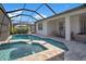 Inviting pool and spa area within a screened enclosure, perfect for relaxation and recreation at 10735 Spring Tide Way, Parrish, FL 34219