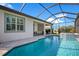 Lovely pool and outdoor dining area in a screened enclosure, perfect for entertaining guests at 10735 Spring Tide Way, Parrish, FL 34219