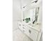 Bright bathroom featuring a double sink vanity, quartz countertops, modern fixtures, and marble tile floor at 3092 Crowder St, Port Charlotte, FL 33980