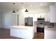 Modern kitchen featuring white cabinets, quartz countertops, and stainless appliances at 3092 Crowder St, Port Charlotte, FL 33980