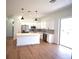 Modern kitchen featuring white cabinets, quartz countertops, and stainless appliances at 3092 Crowder St, Port Charlotte, FL 33980