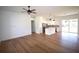 Open-concept living area with kitchen island and stainless steel appliances at 3092 Crowder St, Port Charlotte, FL 33980