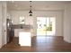 Modern kitchen with white cabinets, gray backsplash, and stainless steel appliances at 3092 Crowder St, Port Charlotte, FL 33980
