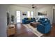 Bright living room with hardwood floors, modern furniture, and ample natural light at 3092 Crowder St, Port Charlotte, FL 33980