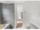 Modern bathroom features stylish tile work, a bathtub, and contemporary fixtures with lots of light at 514 Fitzhugh Ave, Punta Gorda, FL 33950