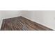 Clean, empty bedroom with dark laminate flooring and white trim at 514 Fitzhugh Ave, Punta Gorda, FL 33950