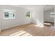 Sunlit bedroom with wood-look flooring, freshly painted walls and natural light at 514 Fitzhugh Ave, Punta Gorda, FL 33950