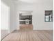Open-concept space with modern kitchen, hardwood floors, and bright windows that create a warm, inviting atmosphere at 514 Fitzhugh Ave, Punta Gorda, FL 33950