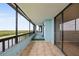 Enjoy the beautiful views of a lake and verdant trees from this inviting, covered balcony at 14810 Rue De Bayonne # 7B, Clearwater, FL 33762