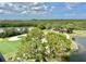 Scenic view of the lush green golf course, showcasing pristine fairways, mature trees, and tranquil water features at 14810 Rue De Bayonne # 7B, Clearwater, FL 33762