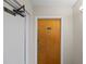 Hallway featuring apartment door, adjacent to an emergency stairway entrance at 14810 Rue De Bayonne # 7B, Clearwater, FL 33762