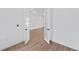 A bedroom with an interior glass door leading to another room and wood-look floors at 2805 Anniston Rd, North Port, FL 34288