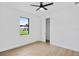 Bedroom featuring a ceiling fan and a window view of the front yard at 2805 Anniston Rd, North Port, FL 34288