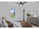Stylized bedroom with neutral tones, ceiling fan and a view of the yard from a window at 2805 Anniston Rd, North Port, FL 34288