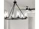 Dining room chandelier with clear shades, complemented by a modern ceiling fan at 2805 Anniston Rd, North Port, FL 34288
