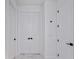 Hallway with white marble-like tile at 2805 Anniston Rd, North Port, FL 34288