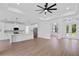A modern kitchen with white cabinets, stainless steel appliances, and a large center island at 2805 Anniston Rd, North Port, FL 34288