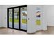 Bright living room featuring sliding glass doors that lead to an outdoor area, enhancing the indoor-outdoor flow at 2805 Anniston Rd, North Port, FL 34288