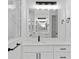 Close up of bright vanity with black fixtures at 2805 Anniston Rd, North Port, FL 34288