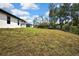 Expansive backyard featuring lush greenery and ample space for outdoor activities and landscaping possibilities at 1080 Dunlap Ave, Spring Hill, FL 34609