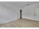 Bedroom with wood-look floors featuring a closet with sliding doors at 1080 Dunlap Ave, Spring Hill, FL 34609