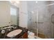 Elegant bathroom with a marble countertop and glass-enclosed shower, providing a spa-like experience at 235 Cocoanut Ave # 129E, Sarasota, FL 34236