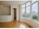 Bright living room with hardwood floors, large windows, and city views at 235 Cocoanut Ave # 129E, Sarasota, FL 34236