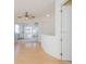 Open-concept living room features beautiful hardwood floors and light colored walls at 235 Cocoanut Ave # 129E, Sarasota, FL 34236