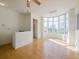 Spacious living room with hardwood floors, high ceilings and city views from bay window at 235 Cocoanut Ave # 129E, Sarasota, FL 34236